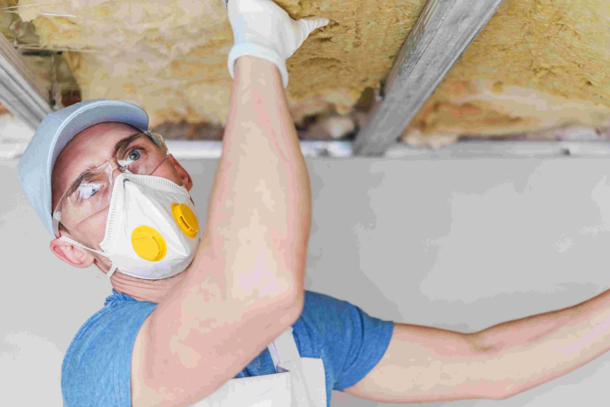 The Cozy Penguin team performing professional insulation removal in a Central Pennsylvania home